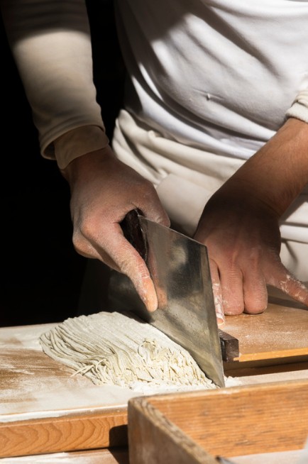 Chef preparing handmade soba noodles in Japan
